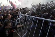 FILE - Russian riot police try to disperse opposition protesters on the eve of Vladimir Putin's inauguration as president, in downtown Moscow on May 6, 2012. Vladimir Putin on Friday Dec. 8, 2023 moved to prolong his repressive and unyielding grip on Russia for another six years, announcing his candidacy in the 2024 presidential election that he is all but certain to win. (AP Photo/Ivan Sekretarev, File)