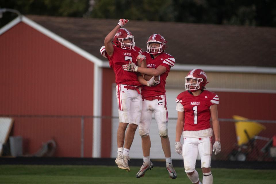 Colon sophomore Owen Wilson and senior Tucker Lafler celebrate Wilson's touchdown during a game against Climax-Scotts at Colon High School on Friday, Sept. 30, 2022.
