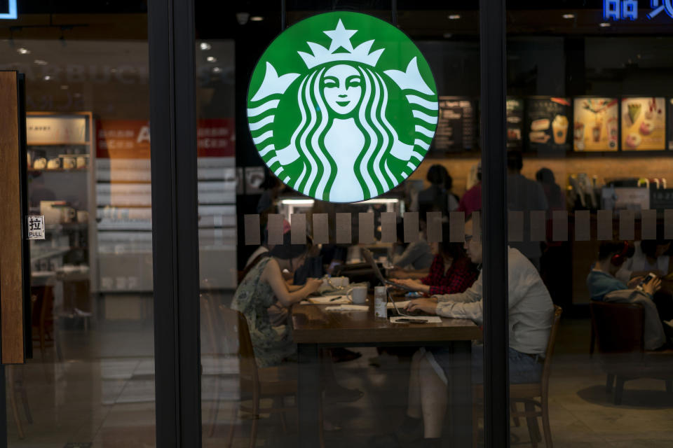 BEIJING, CHINA - 2017/06/02: Customers are working on laptop in a Starbucks coffee shop.  In the second quarter of 2017, Starbucks opened its stores to five new cities in China. As of now, Starbucks China has 2628 stores in 127 cities. More Chinese consumers have been influenced to drink coffee or drink more coffee, so that the turnover in Starbucks has increased by 6%, and the same store revenue in China have increased by 7%. In the next years Starbucks will continue to open one new store at every 15 hours in China. (Photo by Zhang Peng/LightRocket via Getty Images)