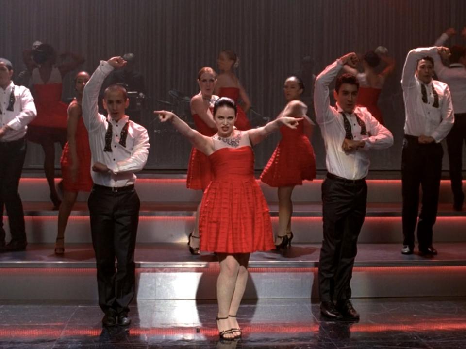 Lindsay Pearce in red dress performing on "Glee"