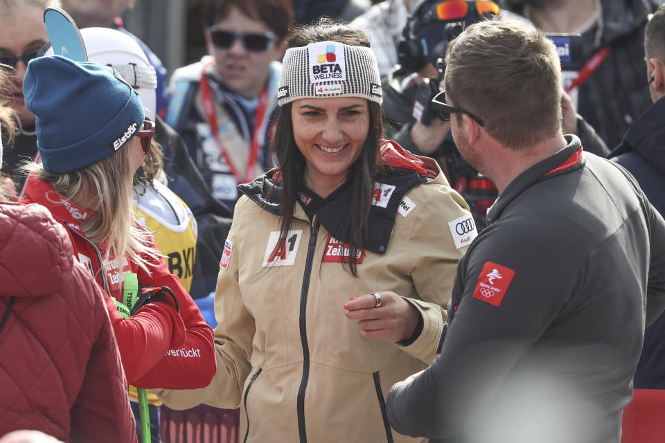 Austria's Stephanie Venier smiles in the finish area after winning an alpine ski, women's World Cup super-G, in Crans Montana, Switzerland, Sunday, Feb. 18, 2024. (AP Photo/Marco Trovati)