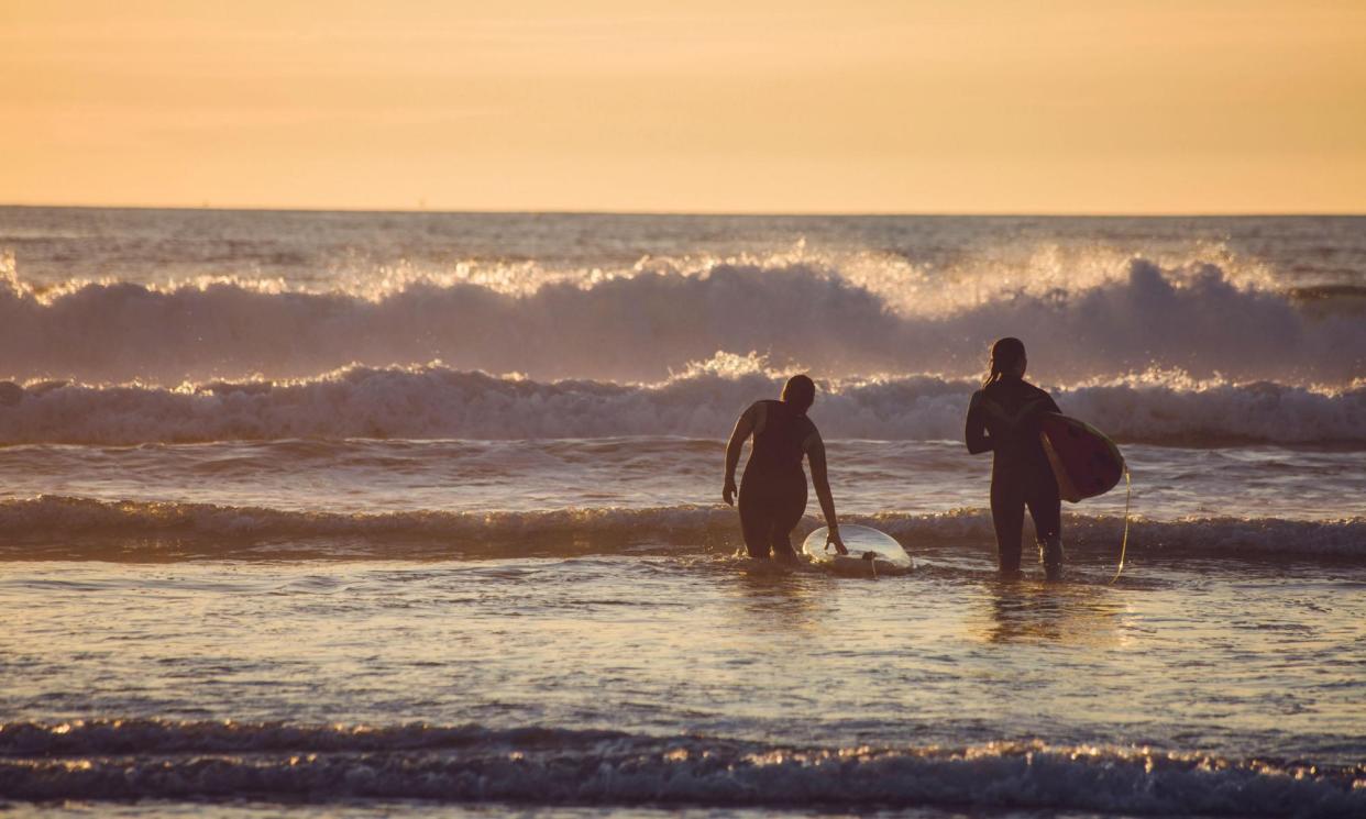 <span>Surfing off the beach in Anglet, just outside Biarritz in French Basque Country.</span><span>Photograph: Andia/Alamy</span>