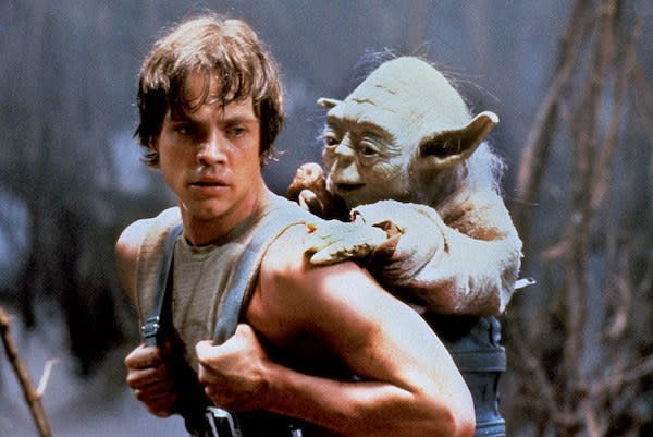 Mark Hamill giving Yoda a piggyback ride