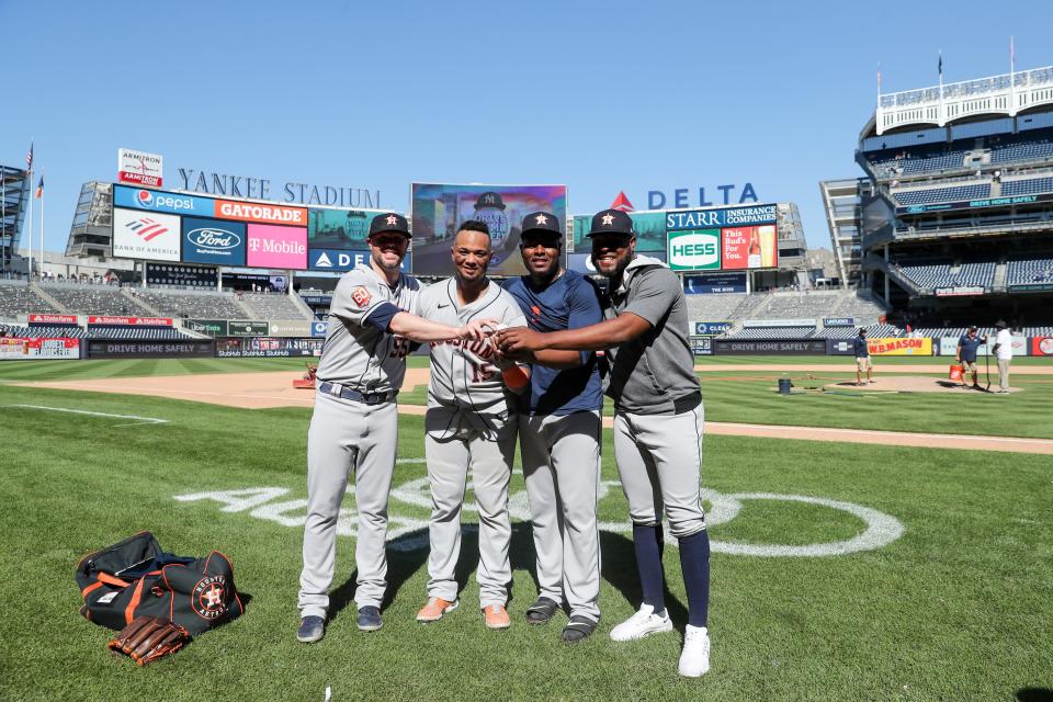 Ryan Pressly, catcher Martin Maldonado, Hector Neris and Cristian Javier pose for a photo after their combined no-hitter.