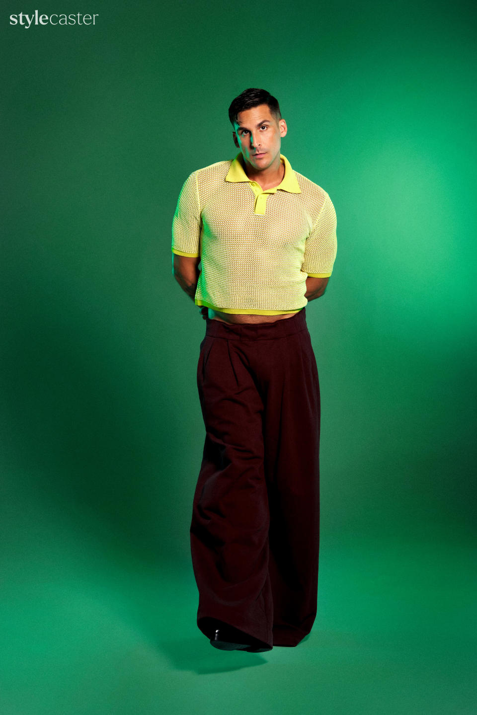 PHOTO: GEORGE CHINSEE. MESH KNIT POLO: BOTTEGA VENETA. WIDE-LEG WOOL PANT: DRIES VAN NOTEN. LEATHER BOOT: SYRO.