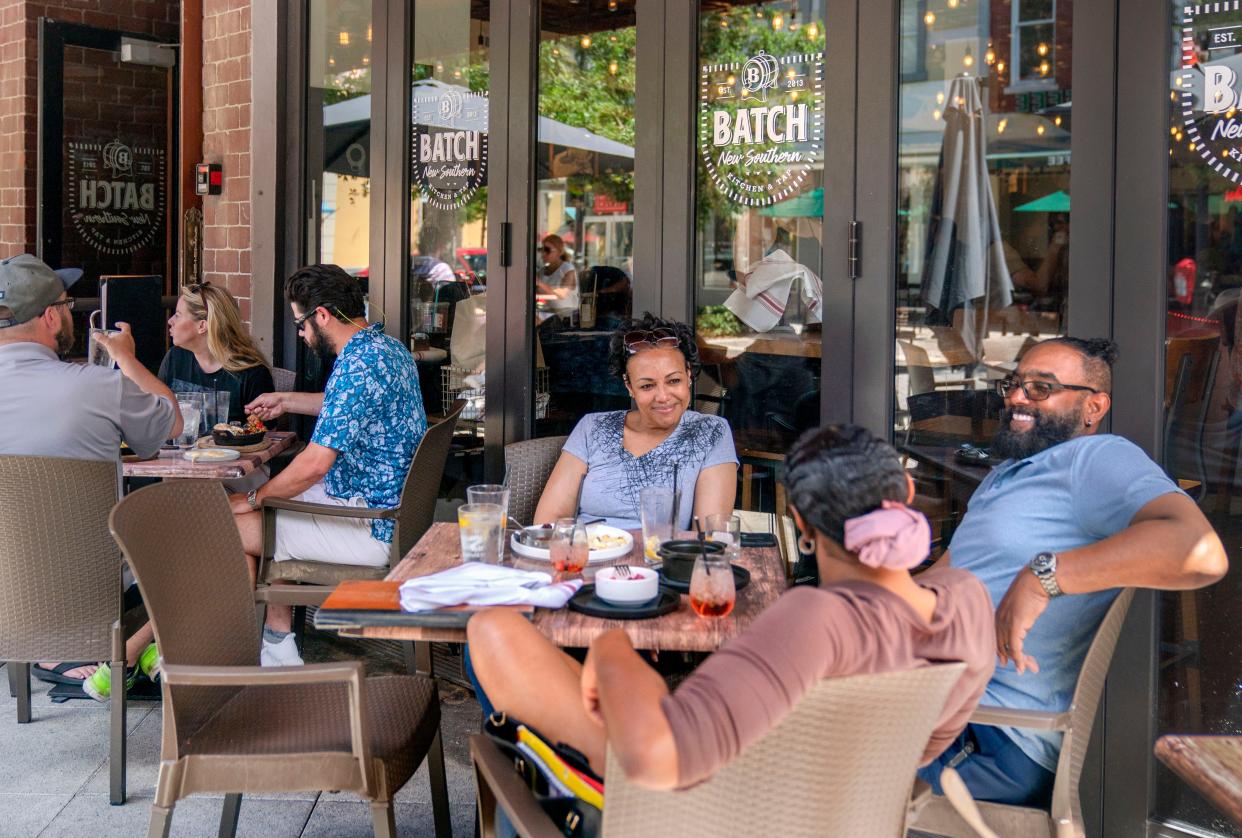 Diners enjoy Sunday brunch at Batch Southern Kitchen & Tap on Clematis Street in West Palm Beach, Florida on April 24, 2022. 