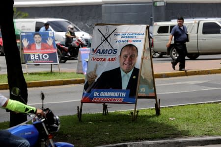 A sign promoting presidential candidate Alejandro Giammattei of 'VAMOS' party is seen ahead of Sunday's presidential election in Guatemala City