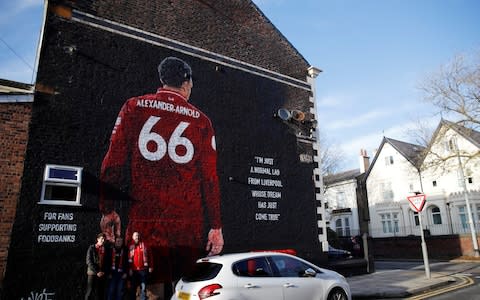 Mural of Liverpool's Trent Alexander-Arnold outside the stadium before the match  - Credit: REUTERS/Phil Noble