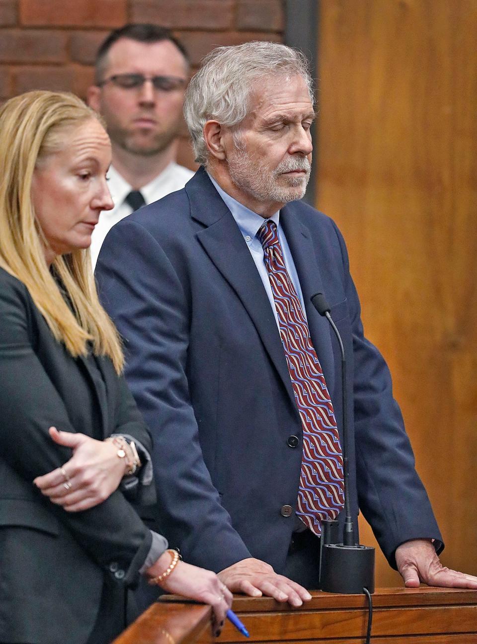 Defense lawyer Kelli Porges, left, and her client, former Norwell pediatrician Richard Kauff, listen during his arraignment in Hingham District Court on Monday, Nov. 20, 2023, on charges of sexual assault.