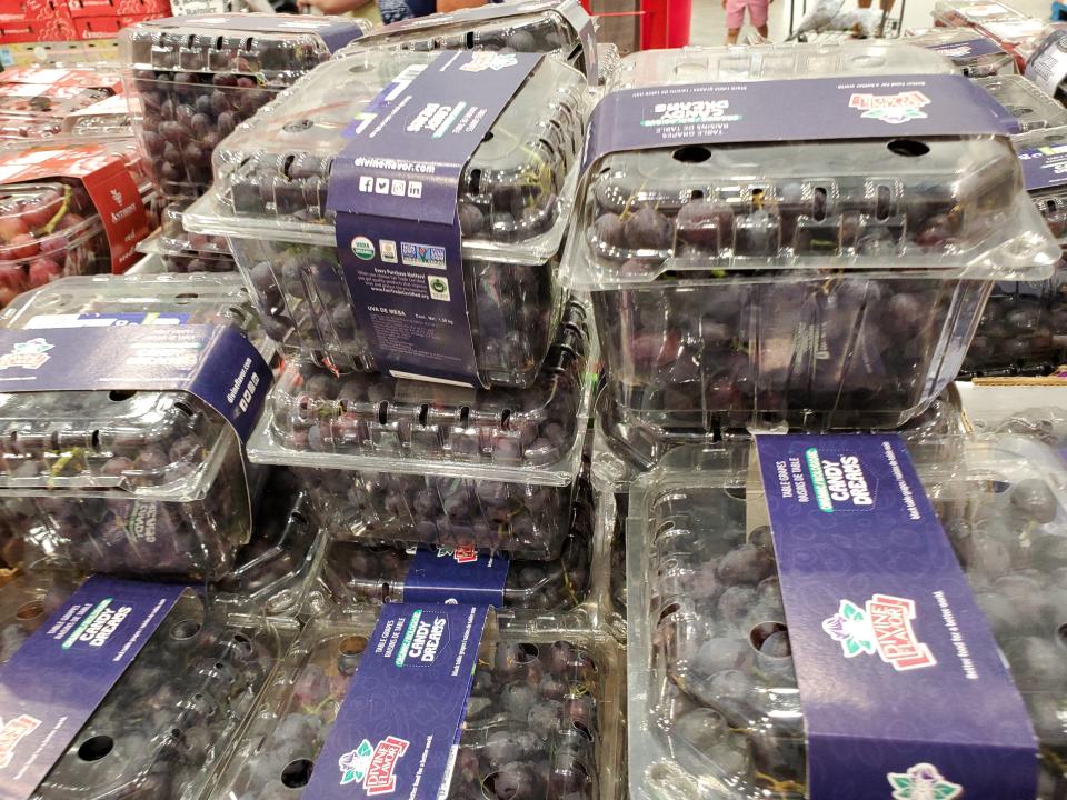 stacks of Grapes in clear packages at Costco