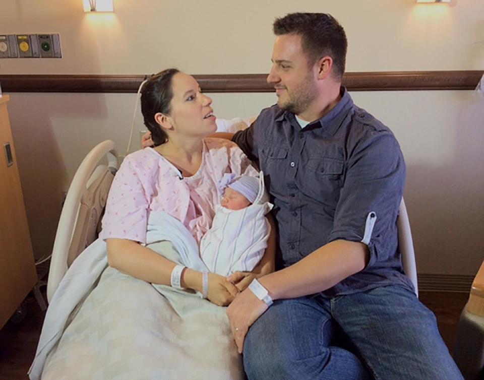 Katherine and Keith Arthur poses with their baby girl, Colette at the hospital Wednesday, Mar. 5, 2014. With help from a 911 dispatcher, the couple delivered their baby girl, Colette, on Wednesday morning in the bathtub of their home in Laguna Nigel, Calif., The dispatcher, Brodie Lefebvre, a father of eight, talked him through the delivery. Lefebvre is the nephew of Jim Lefebvre, who was 1965 National League rookie of the year with the Dodgers.(AP Photo/Orange County Fire Authority,Steve Concialdi)