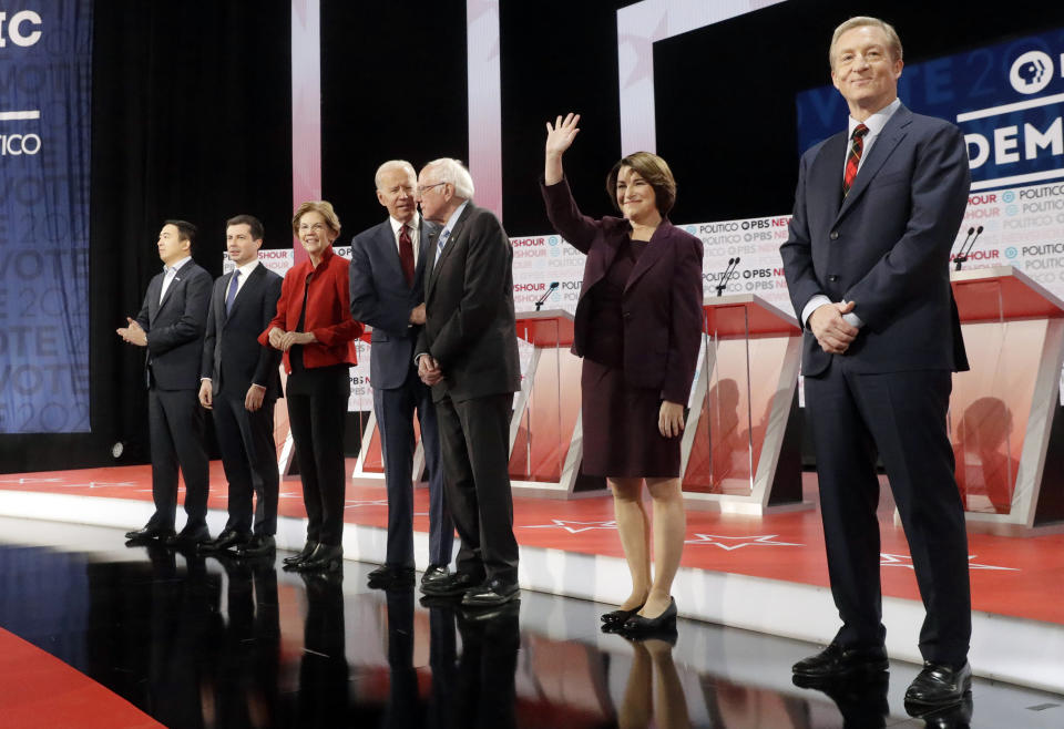 Democratic presidential candidates from left, entrepreneur Andrew Yang, South Bend Mayor Pete Buttigieg, Sen. Elizabeth Warren, D-Mass., former Vice President Joe Biden, Sen. Bernie Sanders, I-Vt., Sen. Amy Klobuchar, D-Minn., and businessman Tom Steyer stand on stage before a Democratic presidential primary debate Thursday, Dec. 19, 2019, in Los Angeles, Calif. (AP Photo/Chris Carlson)