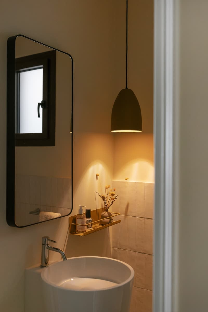 Darkly lite vanity, modern hanging light, modern mirror, small round white sink