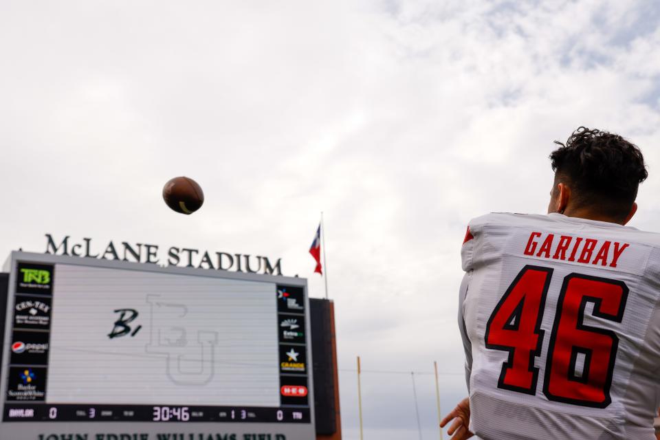 Texas Tech's Jonathan Garibay (46) kicks the ball before the team’s NCAA football game against Baylor on Saturday, Nov. 27, 2021 at John Eddie Williams Field at McLane Stadium in Waco, Texas.