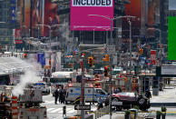 <p>A smashed car, lower right, sits on the corner of Broadway and 45th Street in New York’s Times Square after ploughing through a crowd of pedestrians at lunchtime on Thursday, May 18, 2017. (AP Photo/Seth Wenig) </p>