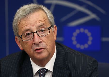 Elected president of the European Commission Jean-Claude Juncker answers journalists questions during a press briefing after his election at the European Parliament in Strasbourg, July 15, 2014. REUTERS/Vincent Kessler