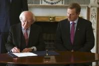 President Michael D. Higgins signs Prime Minister Enda Kenny's (R) Seal of Government to office of Taoiseach in Dublin, Ireland May 6, 2016. REUTERS/Clodagh Kilcoyne