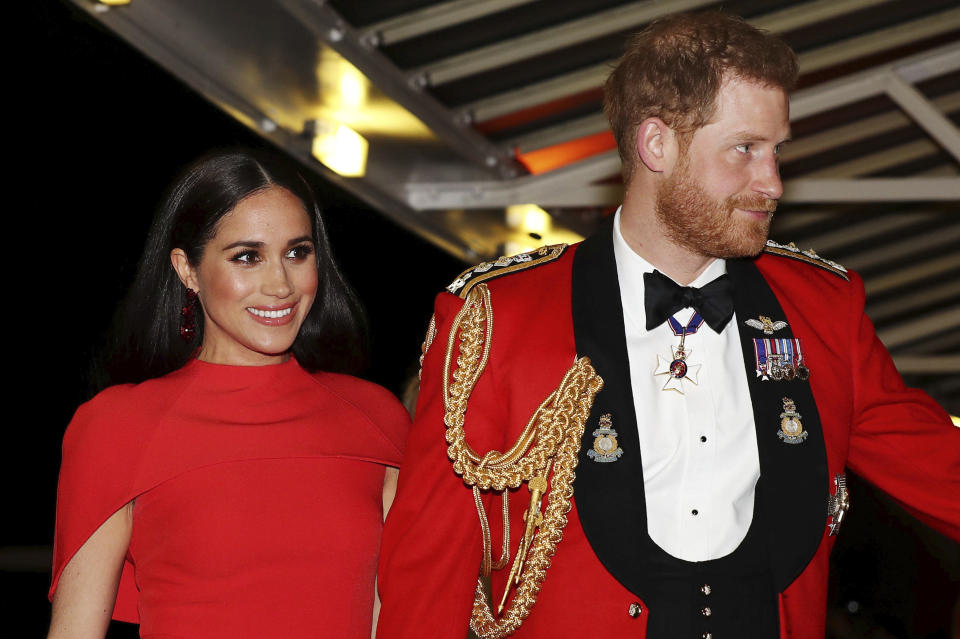 FILE - In this Saturday March 7, 2020 file photo, Britain's Prince Harry and Meghan, Duchess of Sussex arrive at the Royal Albert Hall in London. Meghan, Duchess of Sussex has her first post-royal job: narrating a Disney documentary about elephants. Disney announced Thursday, March 26 that the duchess is lending her voice to “Elephant,” released April 3 on the Disney+ streaming service. (Simon Dawson/Pool via AP, file)