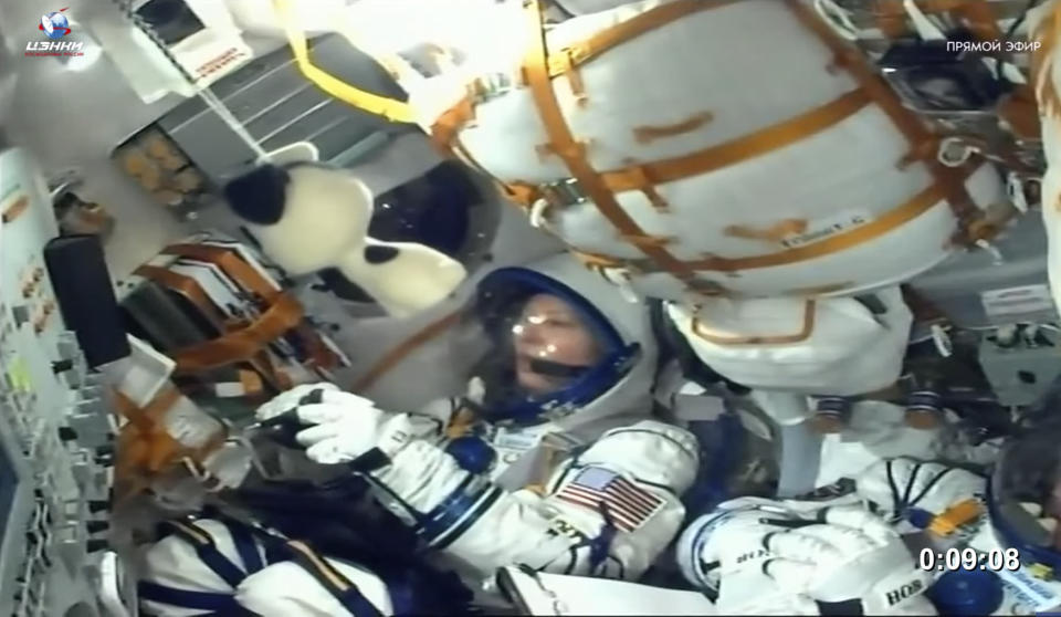 In this photo taken from video released by Roscosmos space corporation, NASA astronaut Tracy Dyson sits in the Soyuz MS-25 space ship prior to cancellation of the launch at the Russian leased Baikonur cosmodrome, Kazakhstan, Thursday, March 21, 2024. Russia's Roscosmos space agency has aborted the launch of three astronauts to the International Space Station about 20 seconds before they were scheduled to lift off. Officials say the crew is safe. The Russian Soyuz rocket was to carry NASA astronaut Tracy Dyson, Oleg Novitsky of Roscosmos and Marina Vasilevskaya of Belarus from the Russia-leased Baikonur launch facility in Kazakhstan. (Roscosmos space corporation via AP)