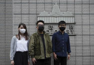 Hong Kong activists, from right, Joshua Wong, Ivan Lam and Agnes Chow arrive at a court in Hong Kong, Monday, Nov. 22. 2020. The trio appears at court for their trial as they face charges related to the besieging of a police station during anti-government protests last year. (AP Photo/Vincent Yu)