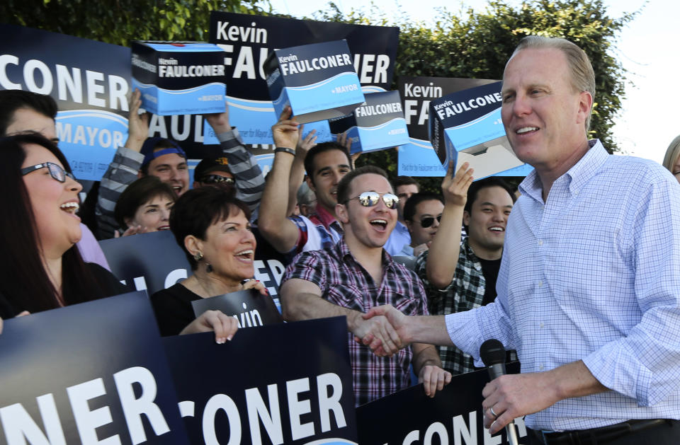 San Diego mayoral candidate Kevin Faulconer shakes hands with his supporters outside his campaign headquarterss Tuesday, Feb. 11, 2014, in San Diego. Faulconer is facing fellow city commissioner David Alvarez in the race to replace disgraced mayor Bob Filner. (AP Photo/Lenny Ignelzi)