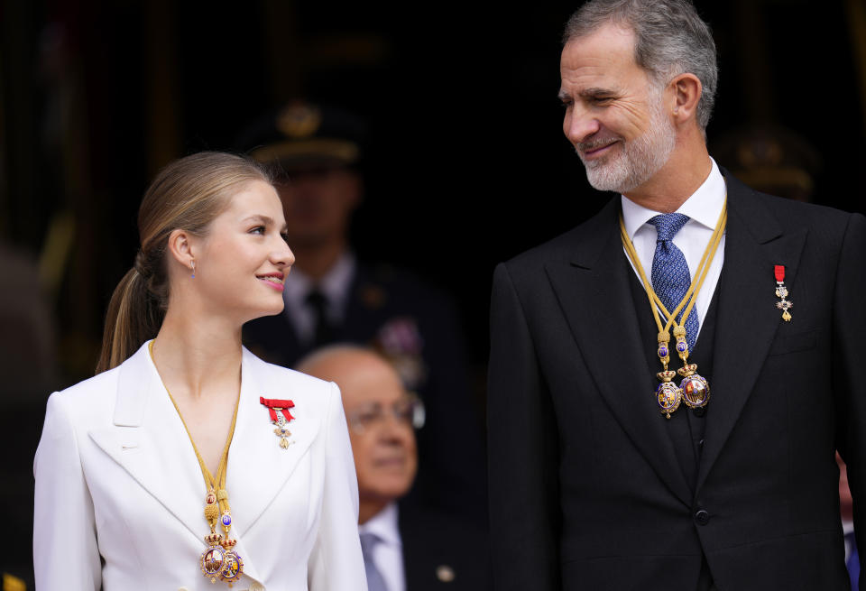 Princess Leonor looks a her father, the Spanish King Felipe VI as they attend a military parade after swearing allegiance to the Constitution during a gala event that makes her eligible to be queen one day, in Madrid on Tuesday, Oct. 31 2023. The heir to the Spanish throne, Princess Leonor, has sworn allegiance to the Constitution on her 18th birthday. Tuesday's gala event paves the way to her becoming queen when the time comes. Leonor is the eldest daughter of King Felipe and Queen Letizia. (AP Photo/Manu Fernandez)