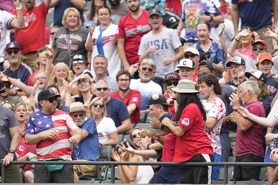 Cleveland Guardians' Steven Kwan's home run ball goes into the stands in the third inning of a baseball game against the Chicago White Sox, Thursday, July 4, 2024, in Cleveland. (AP Photo/Sue Ogrocki)