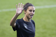 NJ/NY Gotham FC's Carli Lloyd waves to young fans before the team's NWSL soccer match against the Washington Spirit on Wednesday, Oct. 6, 2021, in Chester, Pa. (Charles Fox/The Philadelphia Inquirer via AP)