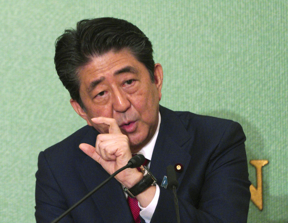 Japanese Prime Minister and head of current party president Shinzo Abe speaks during a debate with another candidate Shigeru Ishiba, ahead of Liberal Democratic Party president election in Tokyo Friday, Sept. 14, 2018. Abe says he will meet again this year for more talks with Russian President Vladimir Putin on Putin's proposal for the two countries to sign a peace treaty and discuss the status of disputed islands. (AP Photo/Eugene Hoshiko)