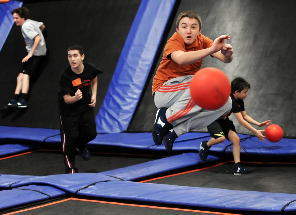 Chris Hoffman, 14 of Indianapolis, jumps off the trampoline to avoid a hit during a pick-up dodge ball game at Sky Zone Indoor Trampoline Park in Fishers on Saturday, February 25, 2012. The Inagural Dodge Ball Tournament is set to take place at Sky Zone on March 12, 2012. (Matt Detrich / The Star)