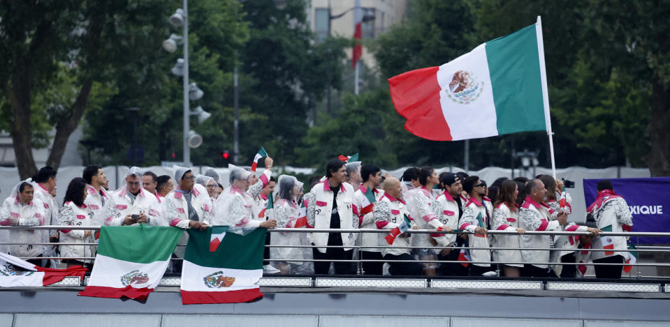 PARIS, FRANCE - JULY 26: Athletes in the delegation of Mexico aboard a boat in the floating parade on the river Seine during the Opening Ceremony of the Olympic Games Paris 2024 on July 26, 2024, in Paris, France. (Photo by Clodagh Kilcoyne - Pool/Getty Images)