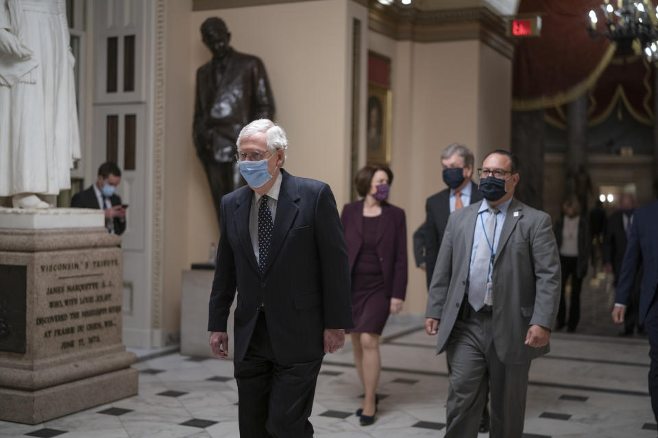 After violent protesters loyal to President Donald Trump stormed the U.S. Capitol today, Senate Majority Leader Mitch McConnell, R-Ky., returns to the House chamber to continue the joint session of the House and Senate and count the Electoral College votes cast in November's election, at the Capitol in Washington, Wednesday, Jan. 6, 2021. (AP Photo/J. Scott Applewhite)