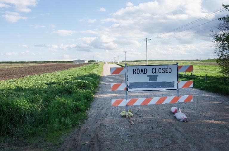 A barricade sits in the road leading to a farm operated by Daybreak Foods, which has been hit with a highly pathogenic strain of avian flu, near Eagle Grove, Iowa on May 17, 2015