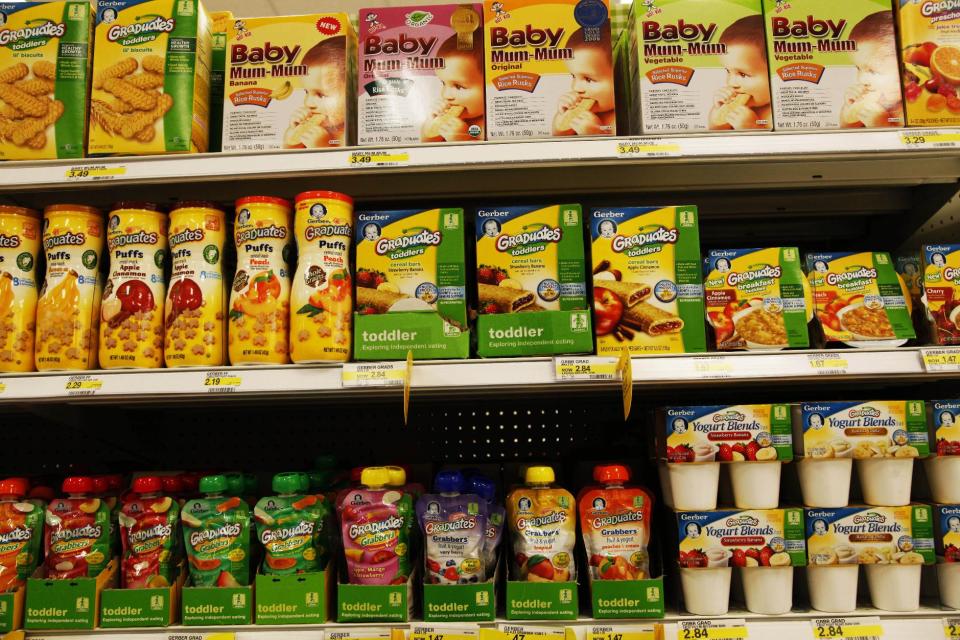 Gerber® Graduates® Grabbers™squeezable fruit or fruit/vegetable pouches made with natural fruits and vegetables sit on the shelf next to other baby food products in the baby food aisle in City Target on Thursday, Jan. 3, 2013, in downtown Los Angeles. Though they can be more expensive, pouches are beloved by parents who can let their kids feed themselves at a young age. (AP Photo/Nick Ut)