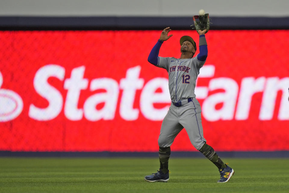 New York Mets shortstop Francisco Lindor (12) catches a ball hit by Miami Marlins' Bryan De La Cruz during the fourth inning of a baseball game, Friday, May 17, 2024, in Miami. (AP Photo/Wilfredo Lee)