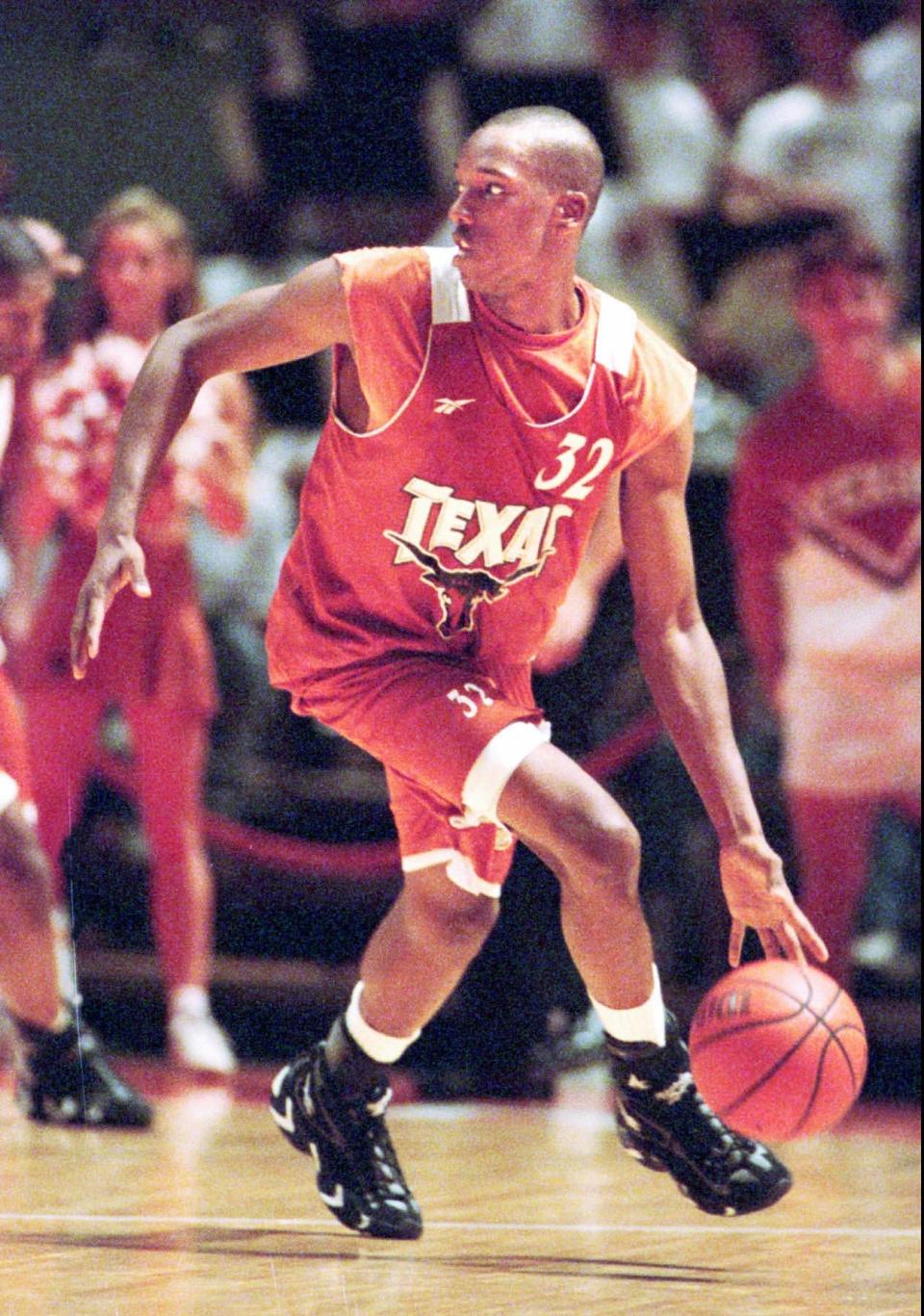 Reggie Freeman dribbles downcourt during the Longhorns' 1996 Orange-White scrimmage at the Erwin Center. Freeman, now 48, will coach a team of former UT players in The Basketball Tournament regionals in Lubbock this week.