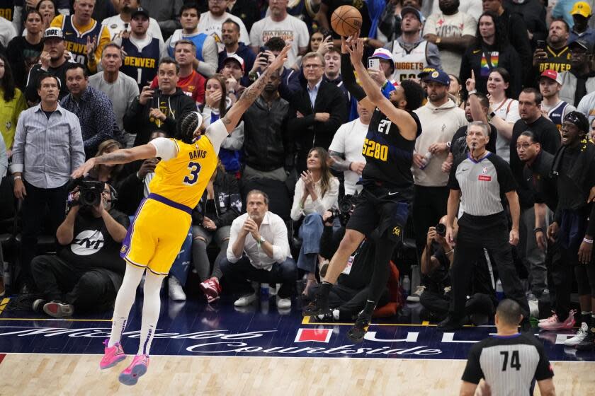 Denver Nuggets guard Jamal Murray (27) hits the game-winning basket against.