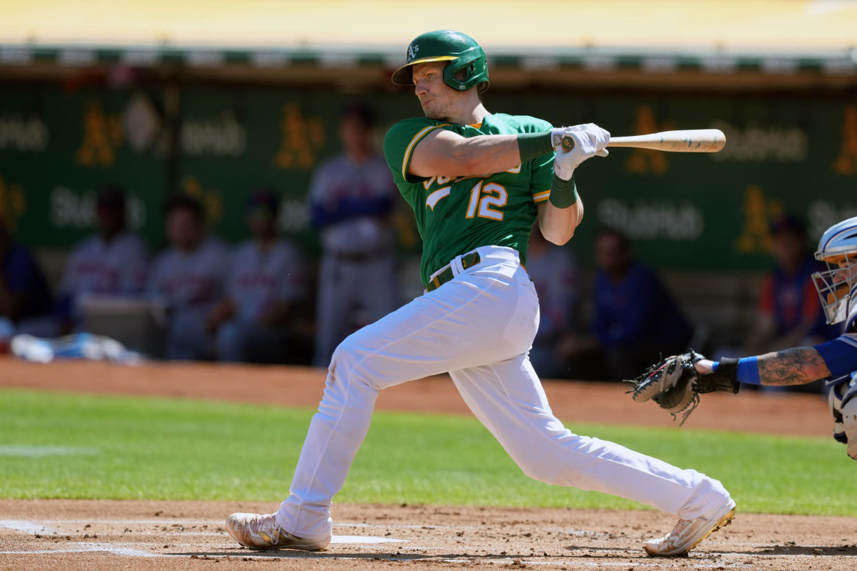 Sep 25, 2022; Oakland, California, USA; Oakland Athletics catcher Sean Murphy (12) hits a double against the New York Mets during the first inning at RingCentral Coliseum. Mandatory Credit: Darren Yamashita-USA TODAY Sports