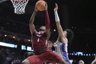 Arkansas' Ricky Council IV is fouled by tk10 during the final seconds of the second half of a second-round college basketball game in the NCAA Tournament Saturday, March 18, 2023, in Des Moines, Iowa. (AP Photo/Morry Gash)