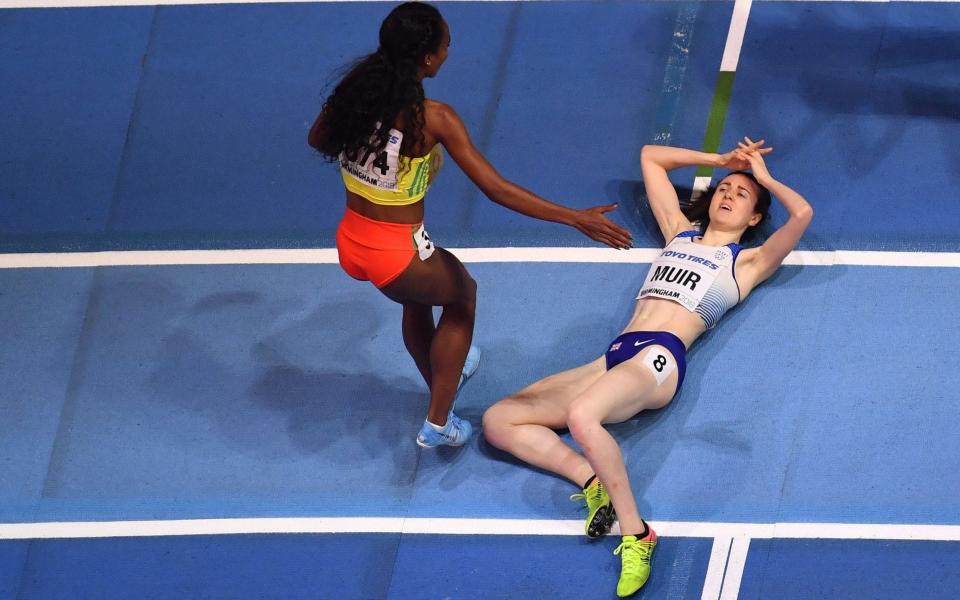 Ethiopia's Genzebe Dibaba congratulates silver medallist Britain's Laura Muir after the women's 1,500m final at the 2018 IAAF World Indoor Athletics Championships  - AFP