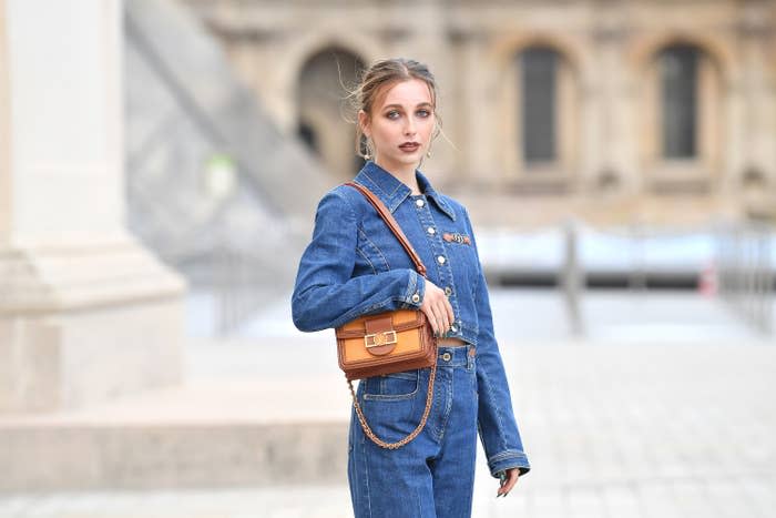 Emma posing at the Louis Vuitton Spring/Summer 2022 show