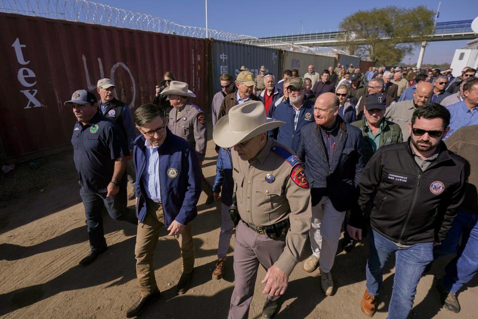 U.S. House Speaker Mike Johnson, center left, and Texas Department of Public Safety chief Steve McCraw, center right, lead a group of Republican members of Congress during a tour of the Texas-Mexico border, Wednesday, Jan. 3, 2024, in Eagle Pass, Texas.