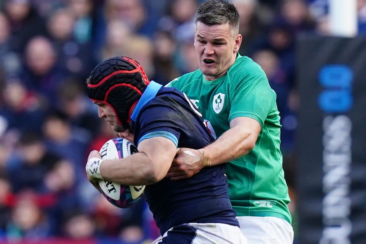 Johnny Sexton, right, made history at Murrayfield (Jane Barlow/PA) (PA Wire)