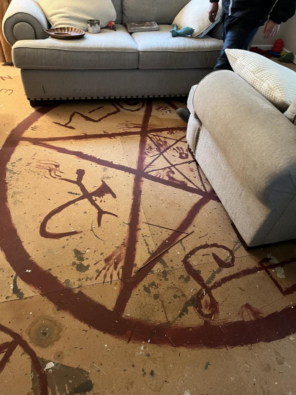 The red pentagram under the flooring. Source: Imgur/supplied