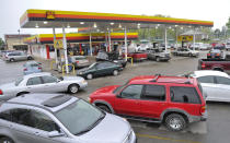 Customers swarm an H&P Max Fuel Express on Main St. Ardmore, Tenn., to purchase lottery tickets for the Mega Millions lottery Friday, March 30, 2012. Lottery ticket lines across the U.S. swelled Friday as players drawn by a record $640 million Mega Millions jackpot took a chance at becoming an overnight millionaire. The jackpot odds were at 1 in 176 million. (AP Photo/The Huntsville Times, Bob Gathany)