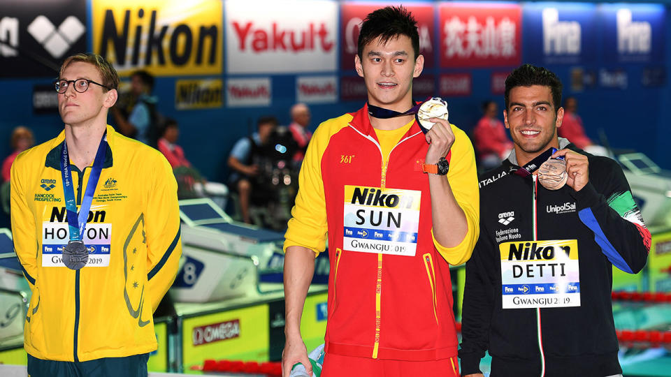 Mack Horton didn't stand next to Sun Yang for photos either. (Photo by OLI SCARFF/AFP/Getty Images)