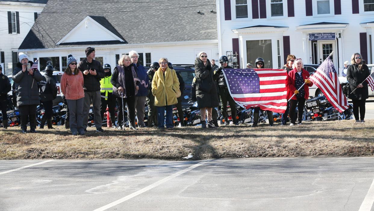 Mourners gather outside Wiggin-Purdy-McCooey-Dion Funeral Home in Dover as the body of late Marine Capt. Jack Casey arrives in Dover Tuesday, Feb. 20, 2024.