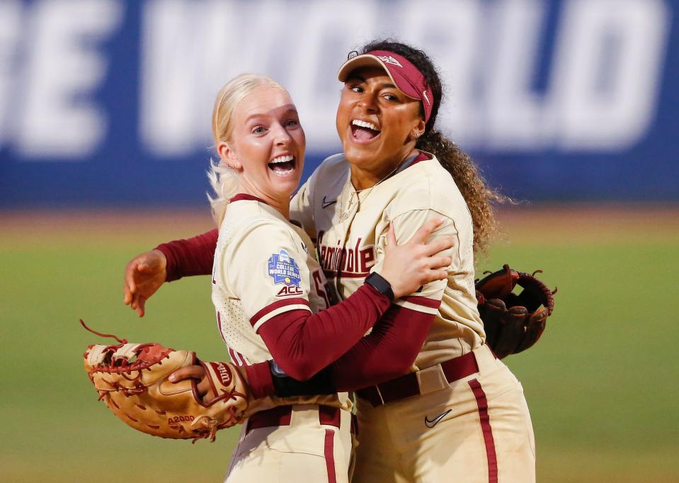 Jun 7, 2021; Oklahoma City, Oklahoma, USA; Florida State’s Sydney Sherrill (24) and Elizabeth Mason (5) celebrate after defeating Alabama during an NCAA Women’s College World Series semi finals game at USA Softball Hall of Fame Stadium. Mandatory Credit: Alonzo Adams-USA TODAY Sports