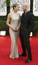 Actors Robin Wright and Ben Foster arrive at the 71st annual Golden Globe Awards in Beverly Hills, California January 12, 2014. REUTERS/Mario Anzuoni (UNITED STATES - Tags: Entertainment)(GOLDENGLOBES-ARRIVALS)