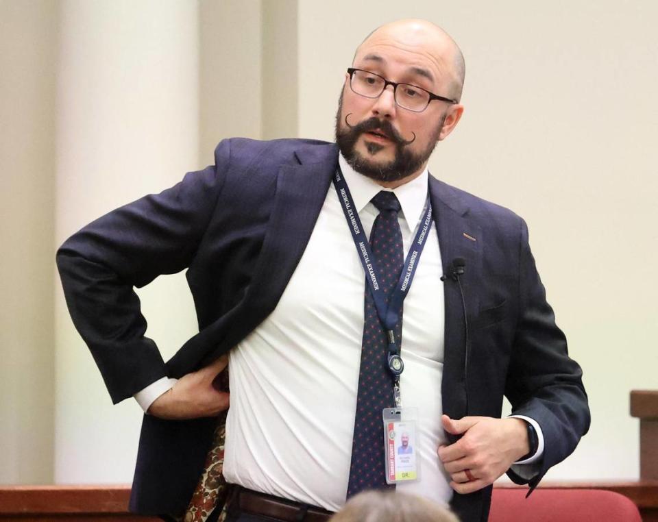 Dr. Richard Fries demonstrates where he found the bullet while performing Atatiana Jefferson’s autopsy during the third day of trial on Wednesday, December 7, 2022. Former Fort Worth police officer Aaron Dean fatally shot Jefferson through a windown while on an open structure call at her Fort Worth residence.